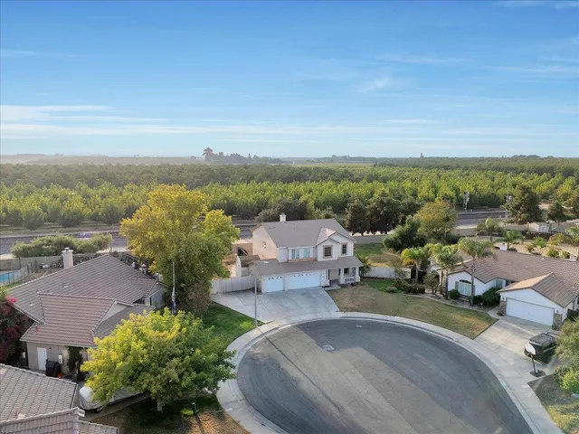 an aerial view of a house with outdoor space