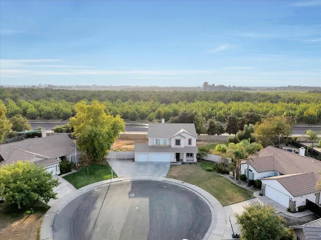an aerial view of a house with a garden