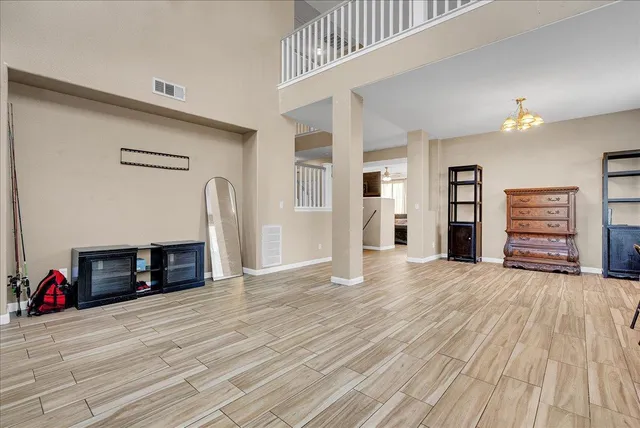 an empty room with wooden floor and closet