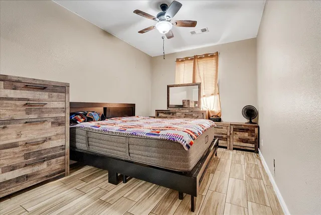 a bedroom with a bed and a window