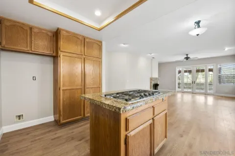 a kitchen with stainless steel appliances granite countertop a stove and a refrigerator