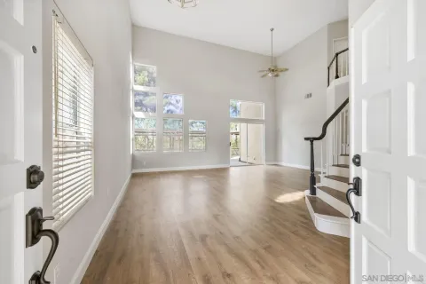 a view of entryway with wooden floor