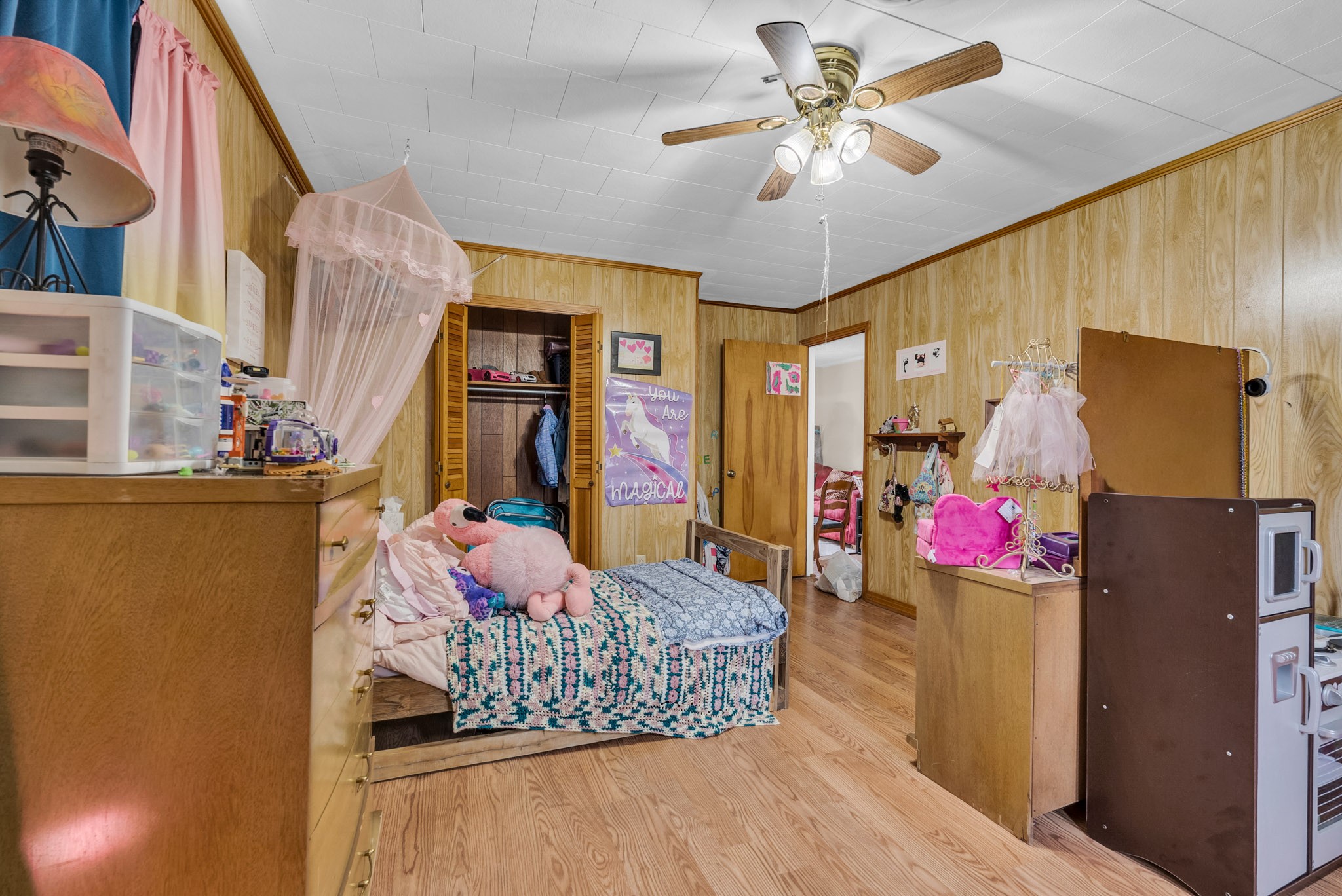 5881 Burgess Falls Road Sparta, TN 38583 - Photo 23 of 29 a bedroom with a bed and a chandelier
