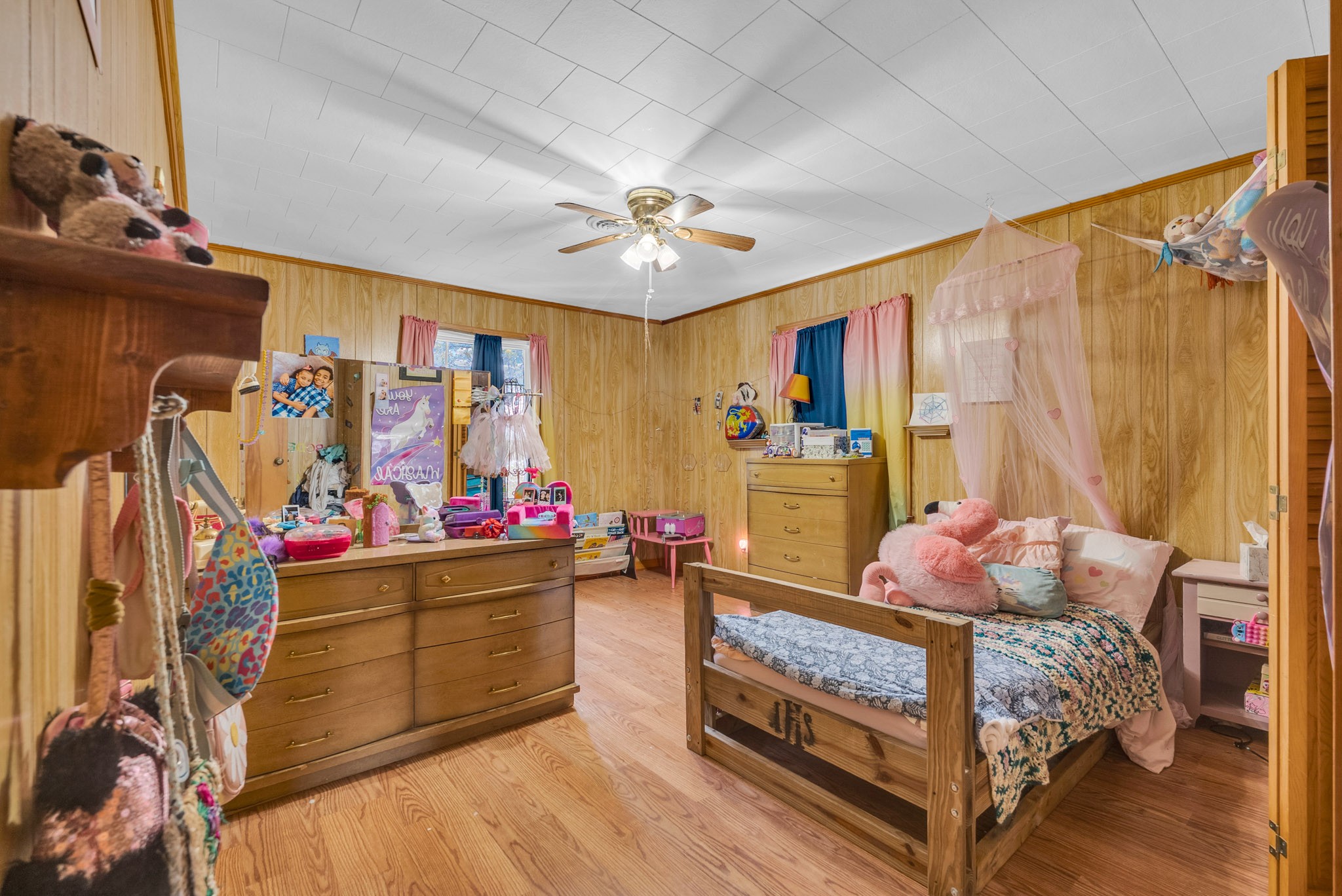 5881 Burgess Falls Road Sparta, TN 38583 - Photo 24 of 29 a bedroom with a bed and a chandelier