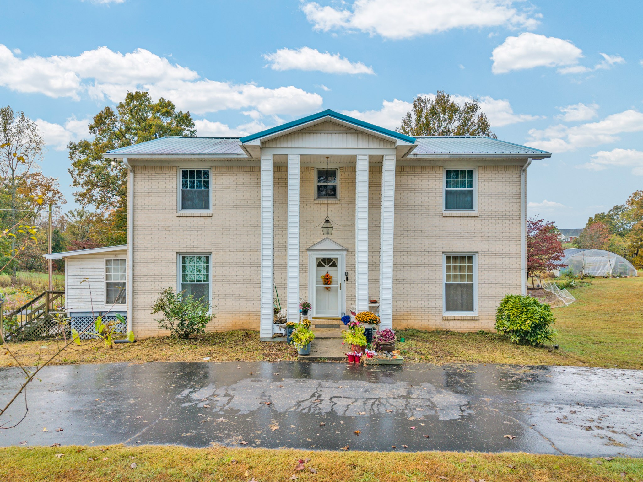 5881 Burgess Falls Road Sparta, TN 38583 - Photo 8 of 29 a front view of a house with a garden