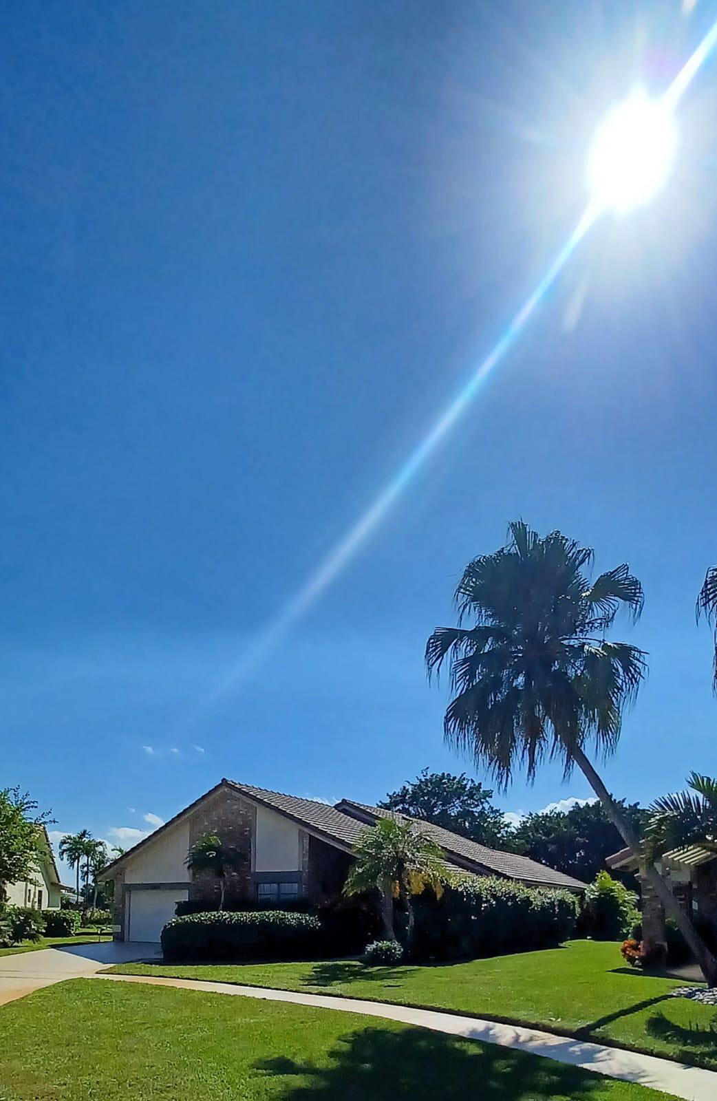 10544 Fenway Place Boca Raton, FL 33498 - Photo 2 of 28 a front view of a house with a yard