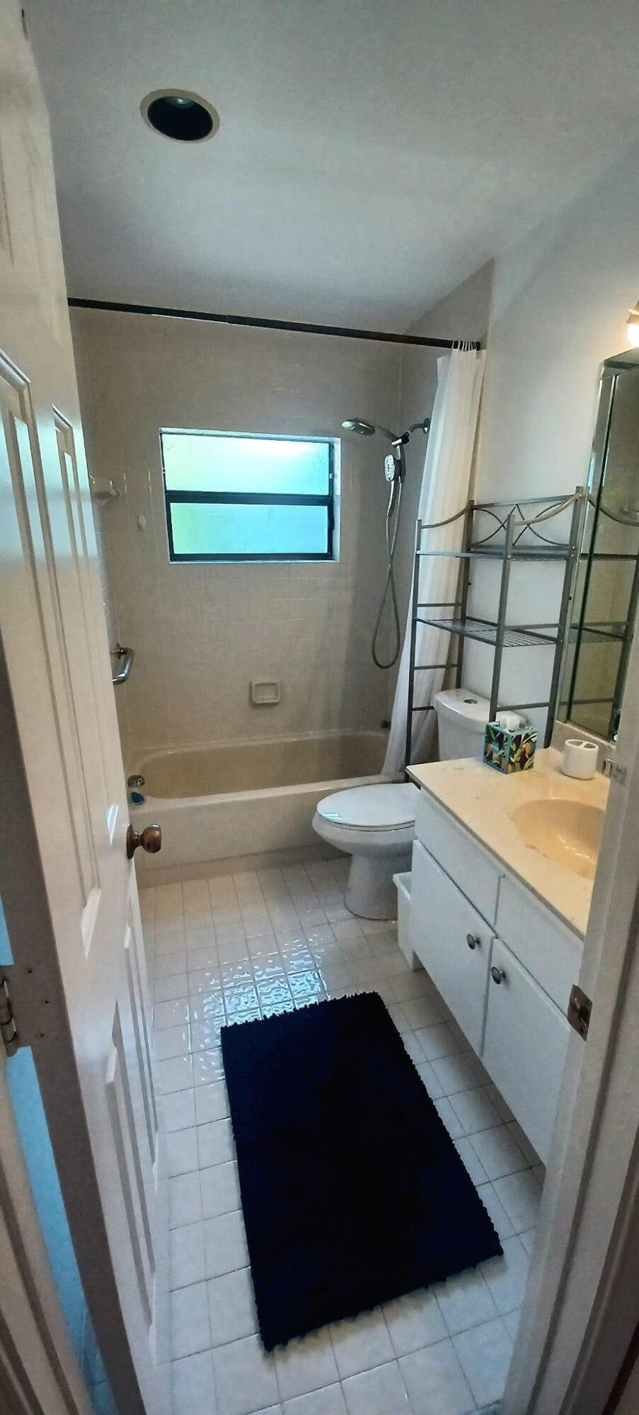 10544 Fenway Place Boca Raton, FL 33498 - Photo 23 of 28 a kitchen with sink and cabinets