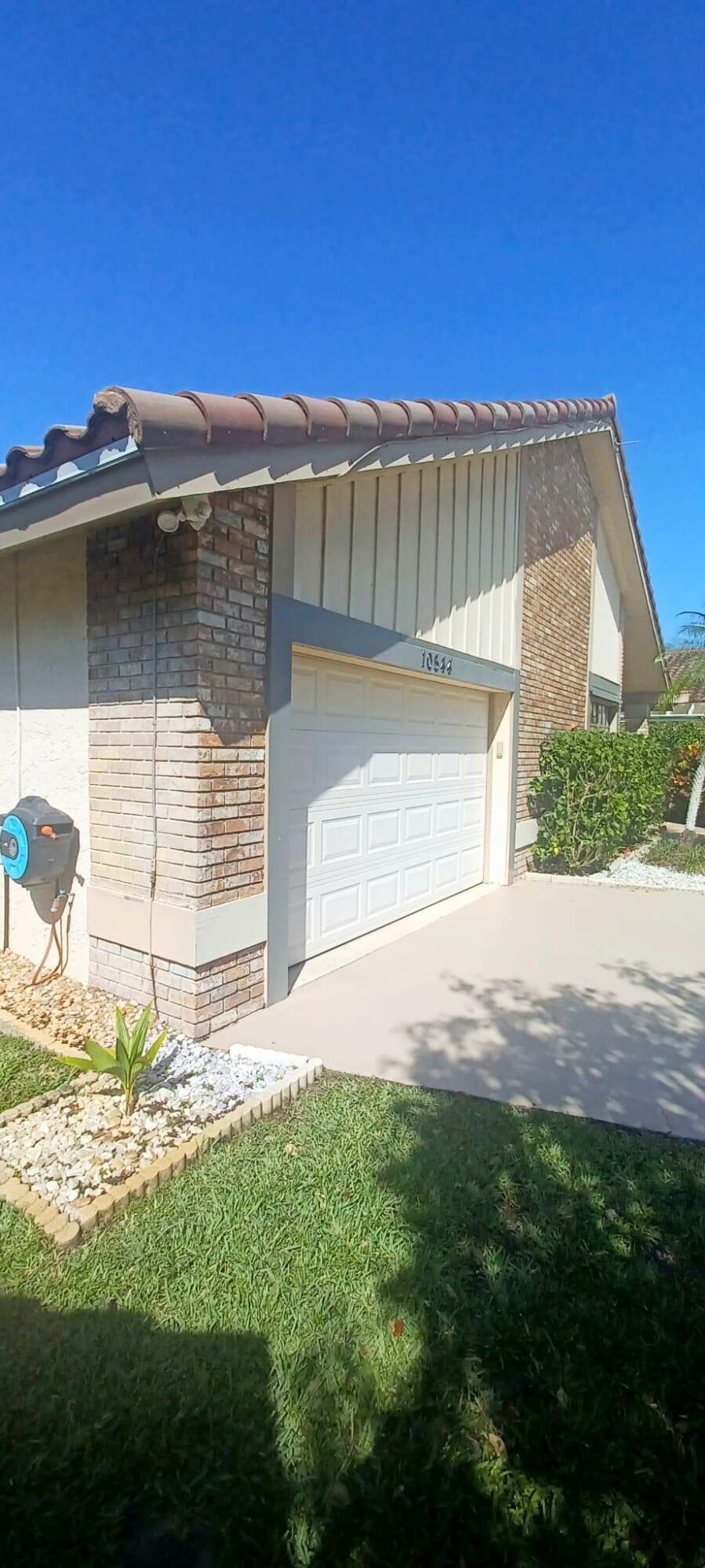 10544 Fenway Place Boca Raton, FL 33498 - Photo 7 of 28 a front view of a house with a yard