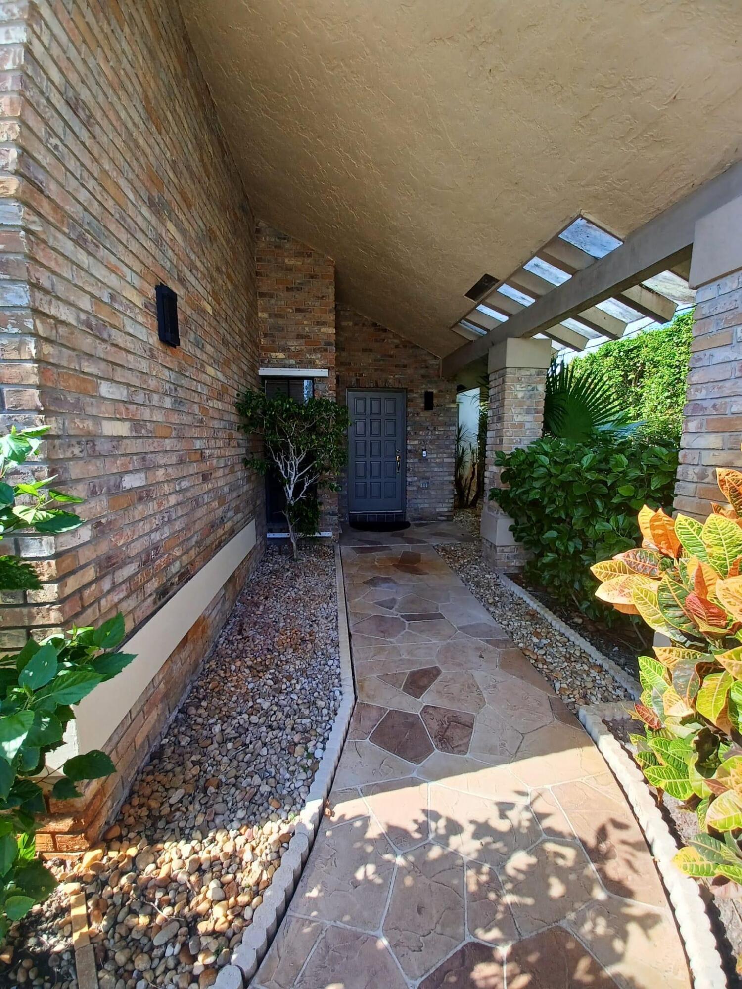 10544 Fenway Place Boca Raton, FL 33498 - Photo 8 of 28 a view of a backyard with pathway