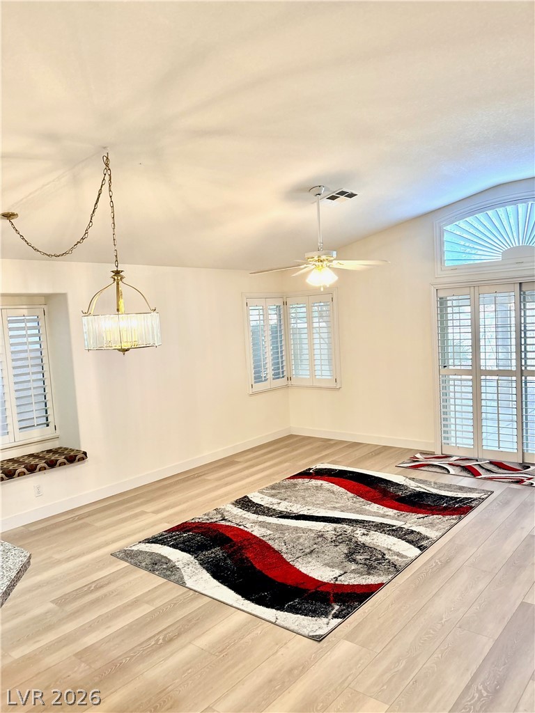 9040 Dove River Road Las Vegas, NV 89134 - Photo 8 of 22 Vaulted ceilings and wide-plank flooring define this airy, open-concept living space.