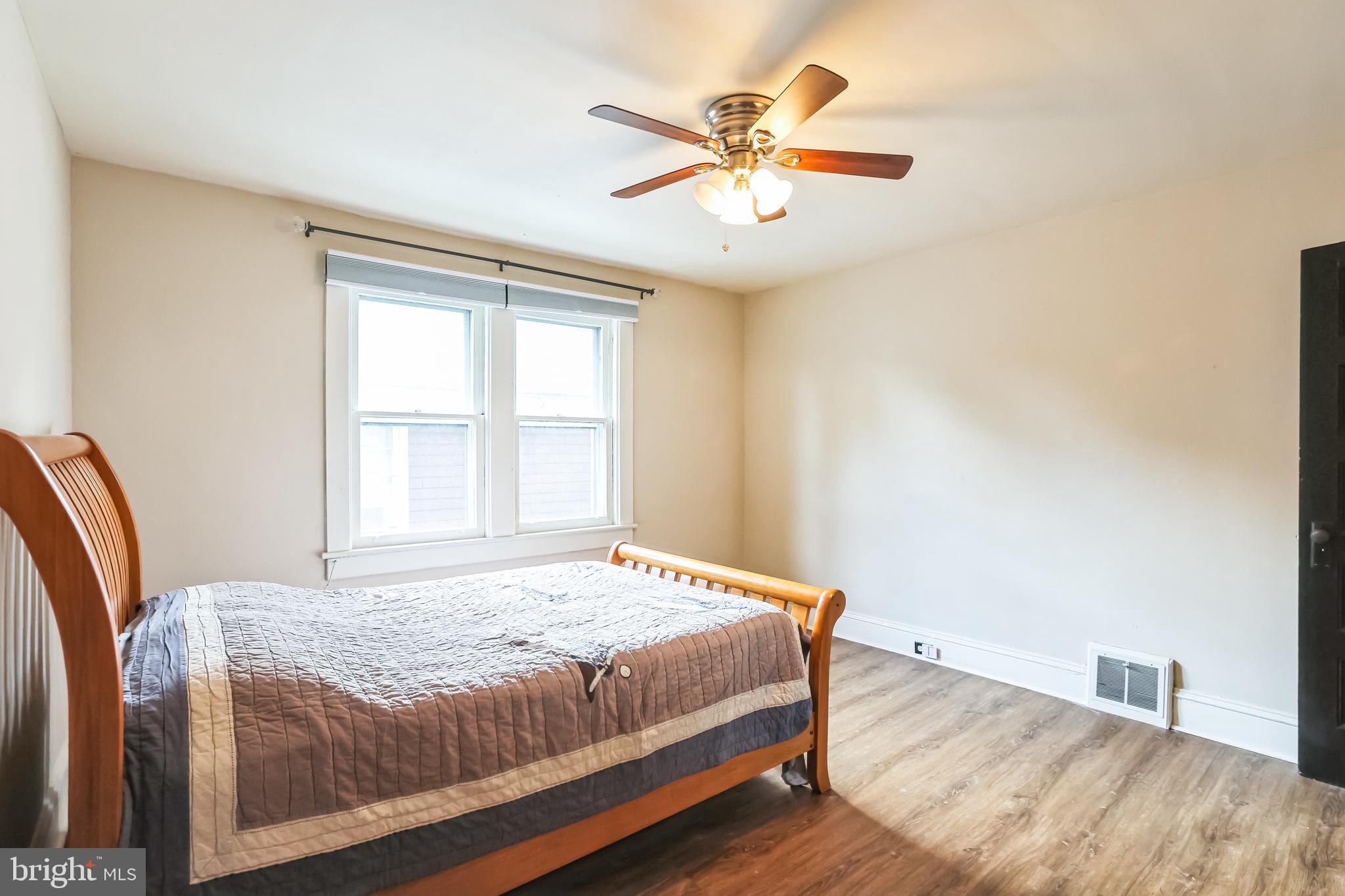 127 Sycamore Road Riegelsville, PA 18077 - Photo 18 of 34 a bedroom with a large bed and a window