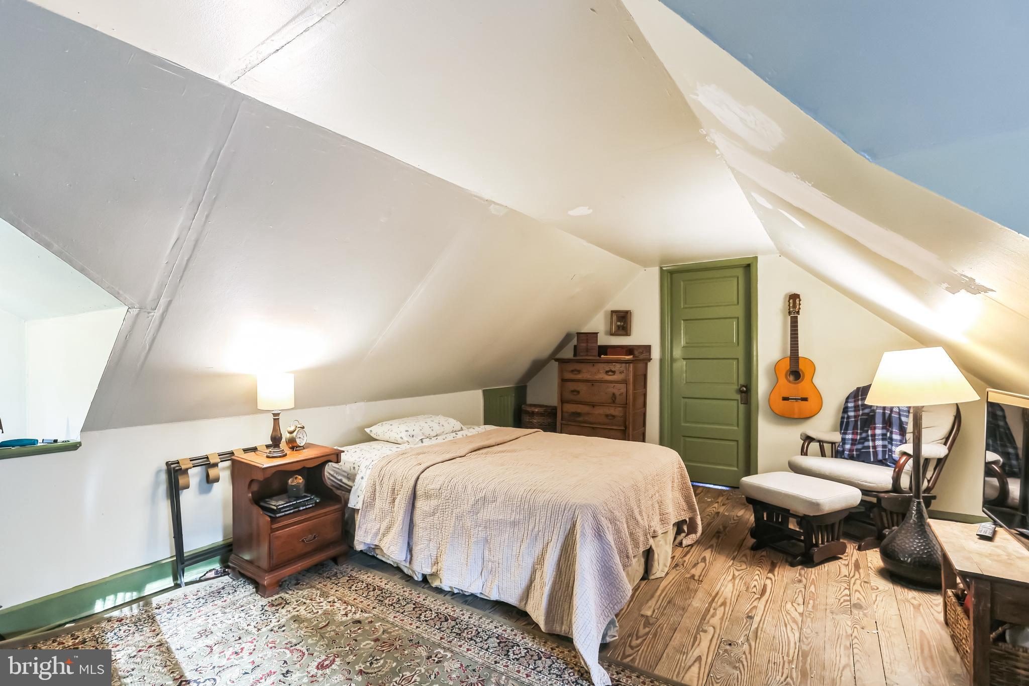 127 Sycamore Road Riegelsville, PA 18077 - Photo 20 of 34 a bedroom with a bed and wooden floor