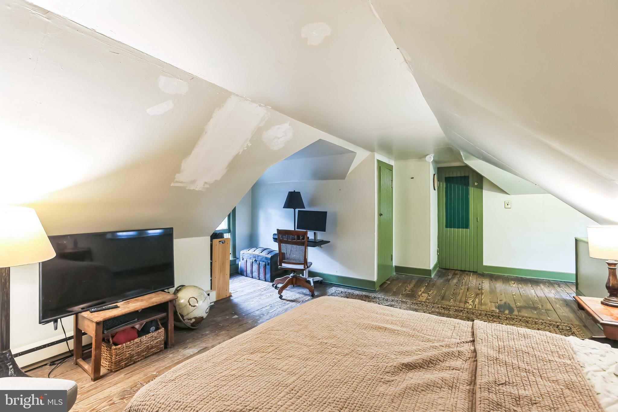 127 Sycamore Road Riegelsville, PA 18077 - Photo 22 of 34 a living room with furniture and a flat screen tv