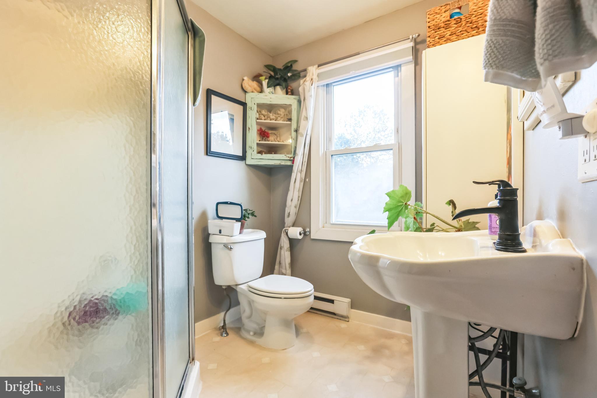 127 Sycamore Road Riegelsville, PA 18077 - Photo 23 of 34 a bathroom with a granite countertop sink and a toilet