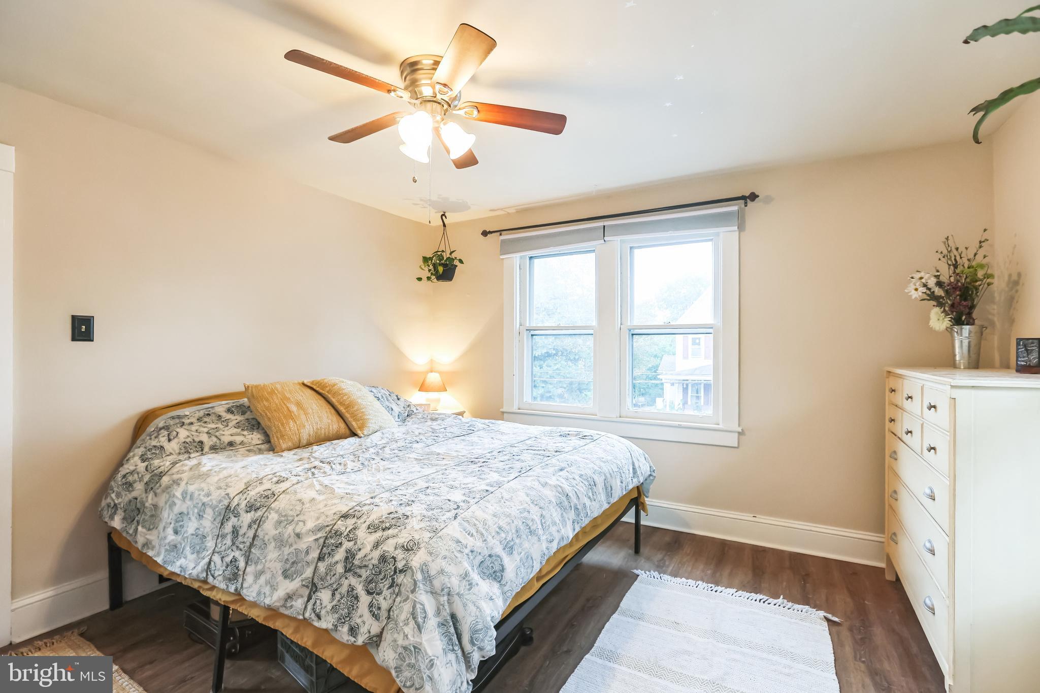127 Sycamore Road Riegelsville, PA 18077 - Photo 25 of 34 a bedroom with a bed chandelier and a window