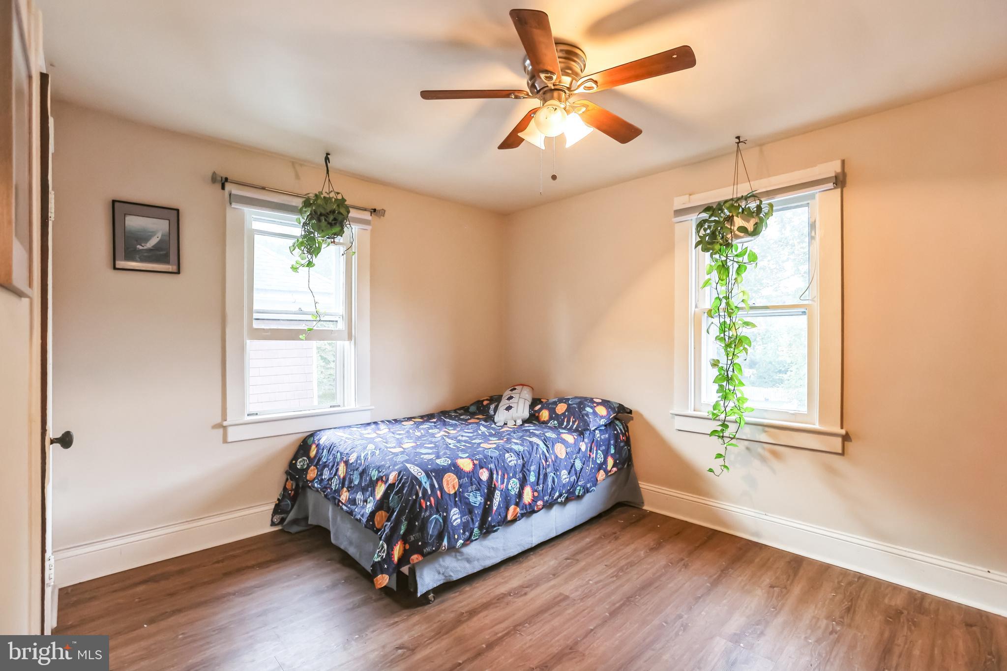 127 Sycamore Road Riegelsville, PA 18077 - Photo 26 of 34 a bedroom with a bed chandelier and a window
