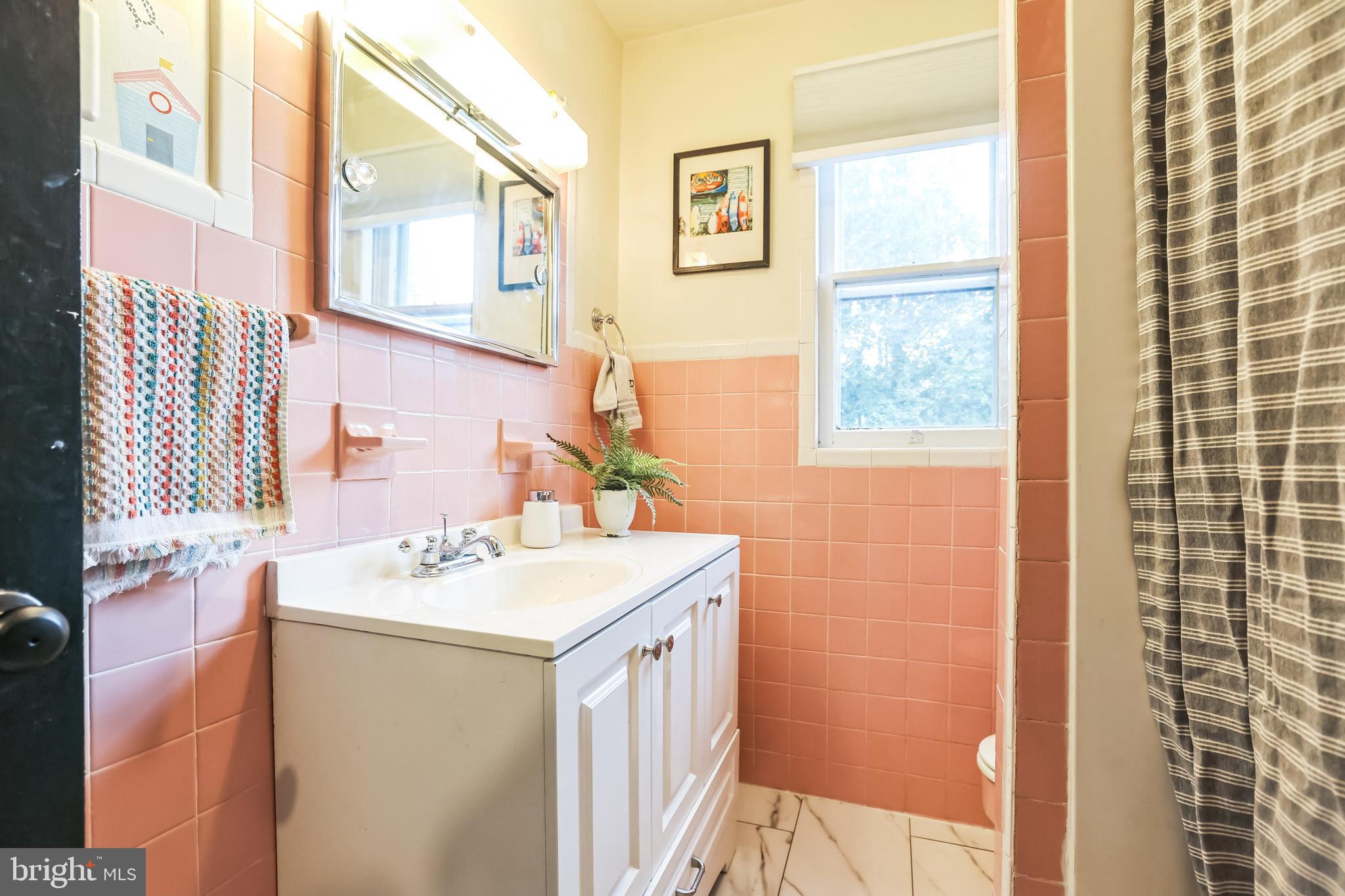 127 Sycamore Road Riegelsville, PA 18077 - Photo 29 of 34 a bathroom with a sink a vanity and a mirror