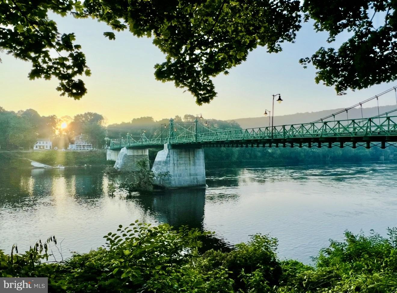 127 Sycamore Road Riegelsville, PA 18077 - Photo 33 of 34 a view of a lake with a house in the background