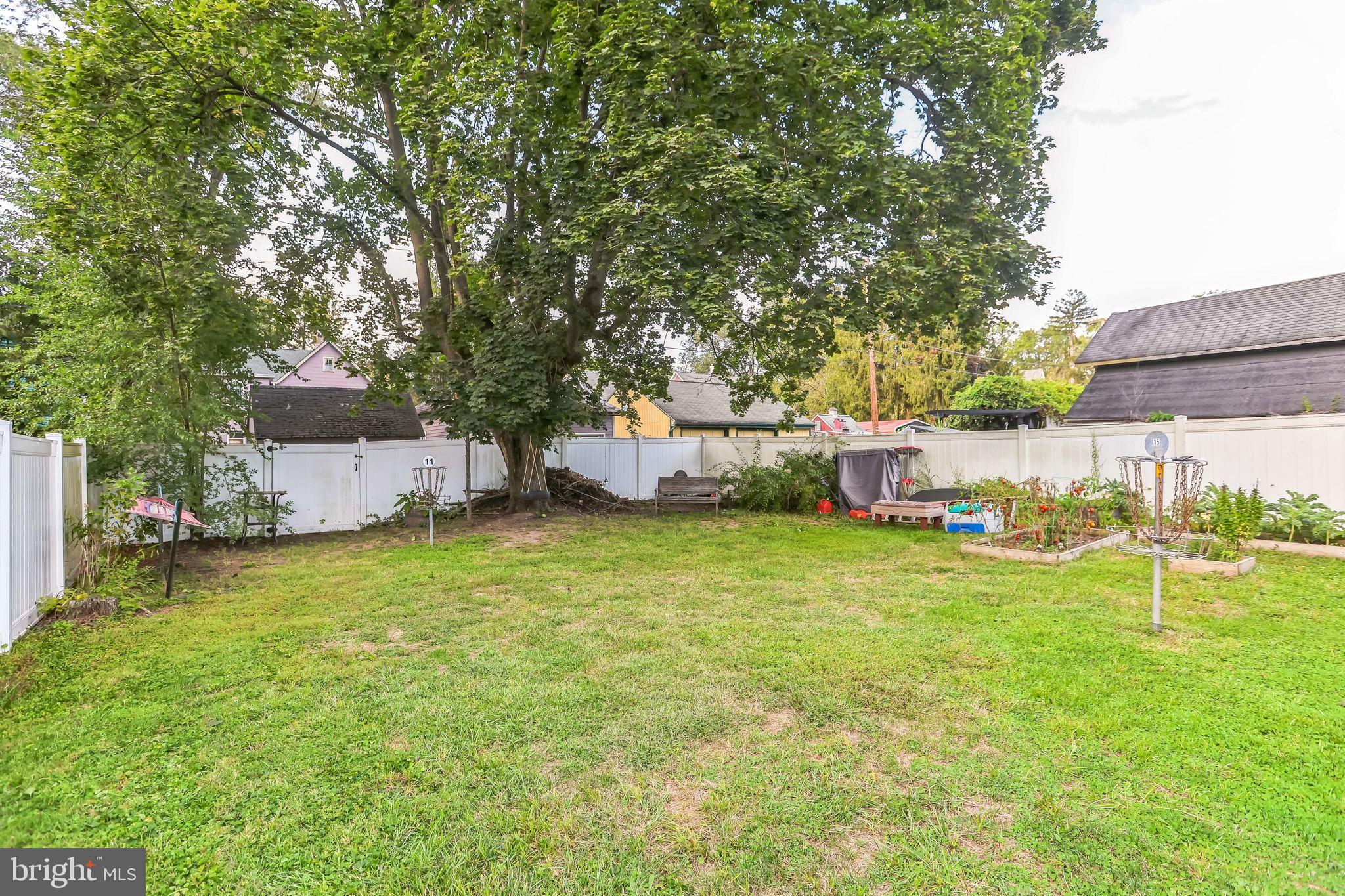 127 Sycamore Road Riegelsville, PA 18077 - Photo 5 of 34 a backyard of a house with table and chairs