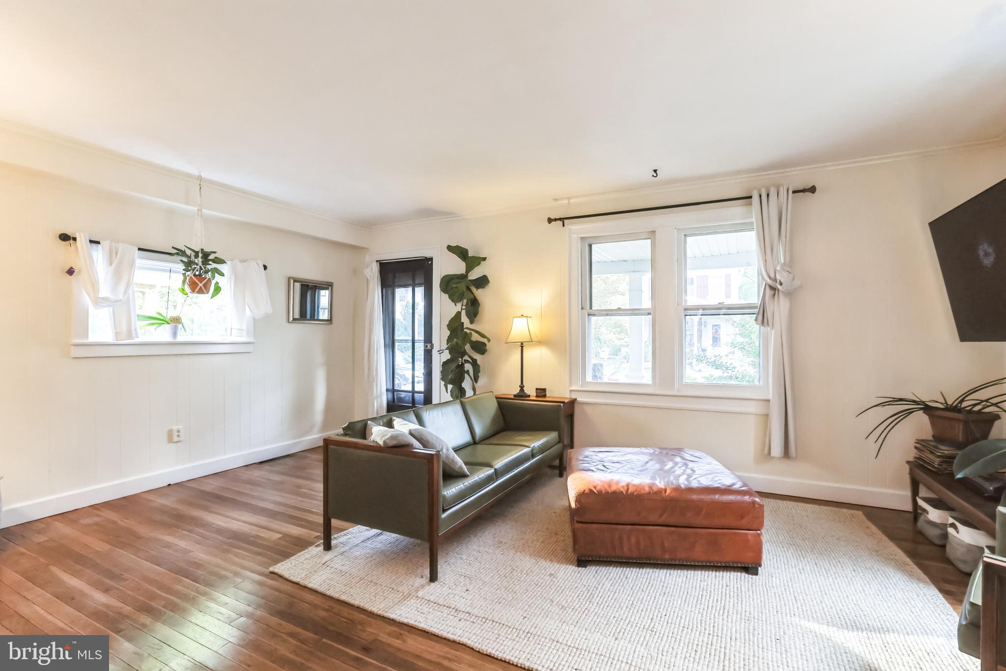127 Sycamore Road Riegelsville, PA 18077 - Photo 9 of 34 a living room with furniture and a flat screen tv
