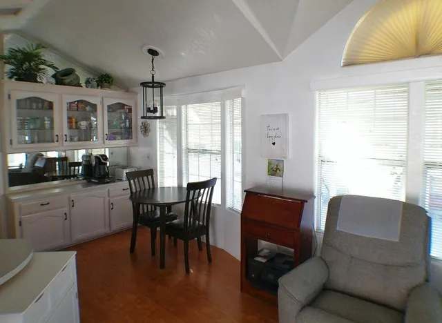 a kitchen with cabinets a sink and appliances