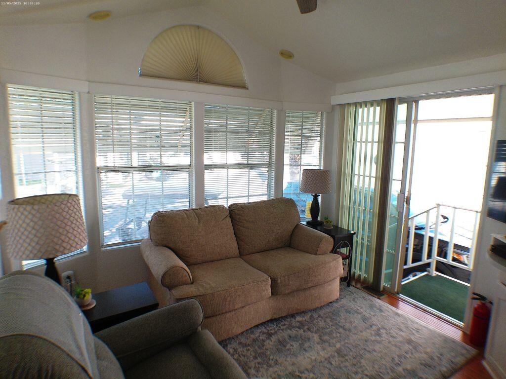 84136 Ave 44, Unit 628 Indio, CA 92203 - Photo 18 of 34 a living room with furniture and a large window