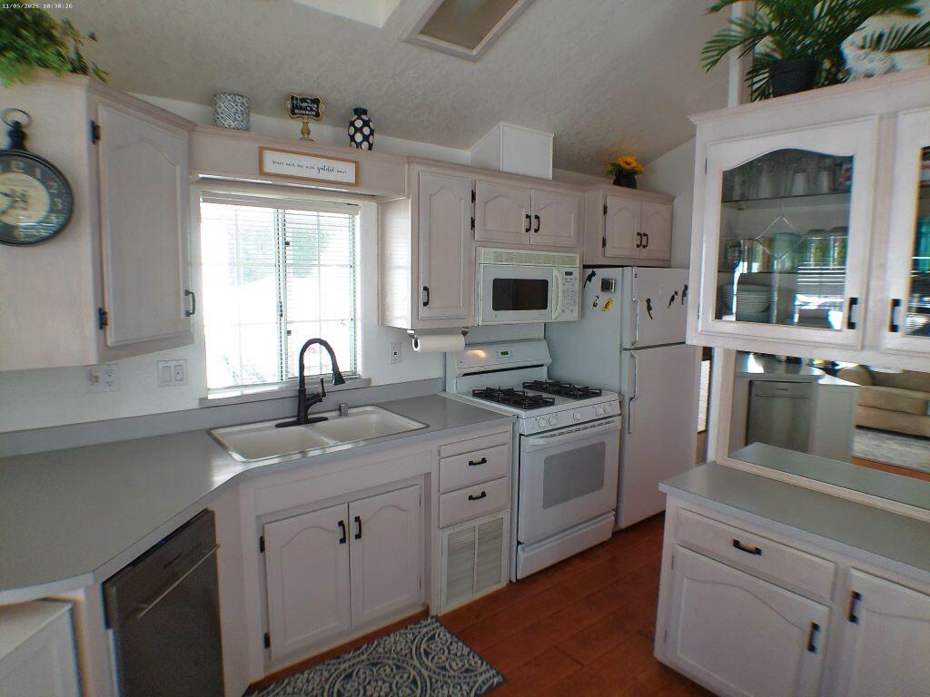 84136 Ave 44, Unit 628 Indio, CA 92203 - Photo 19 of 34 a kitchen with stainless steel appliances granite countertop a sink a stove and cabinets
