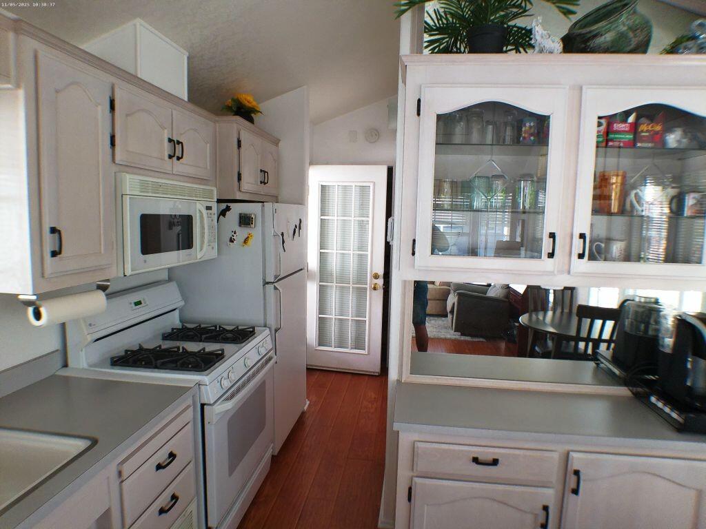 84136 Ave 44, Unit 628 Indio, CA 92203 - Photo 20 of 34 a kitchen with stainless steel appliances a refrigerator a stove and white cabinets