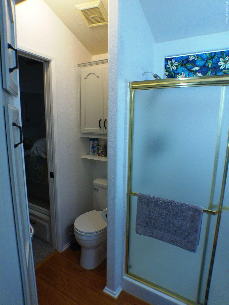 84136 Ave 44, Unit 628 Indio, CA 92203 - Photo 23 of 34 a bathroom with a toilet and a shower