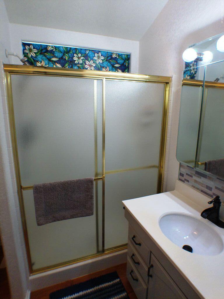 84136 Ave 44, Unit 628 Indio, CA 92203 - Photo 24 of 34 a bathroom with a sink and a mirror