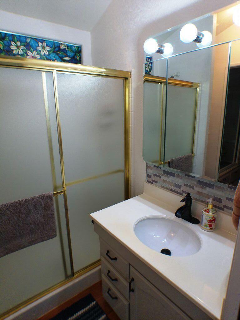 84136 Ave 44, Unit 628 Indio, CA 92203 - Photo 25 of 34 a bathroom with a sink and mirror