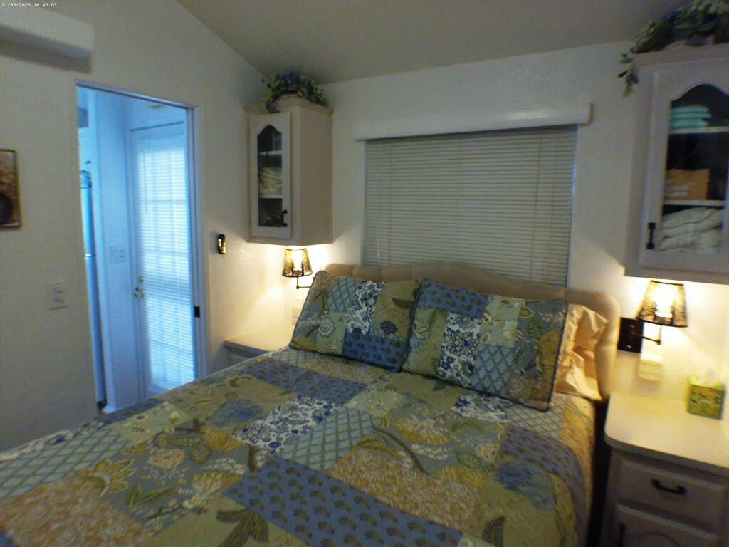 84136 Ave 44, Unit 628 Indio, CA 92203 - Photo 28 of 34 a bed sitting in a bedroom and dressers next to a window