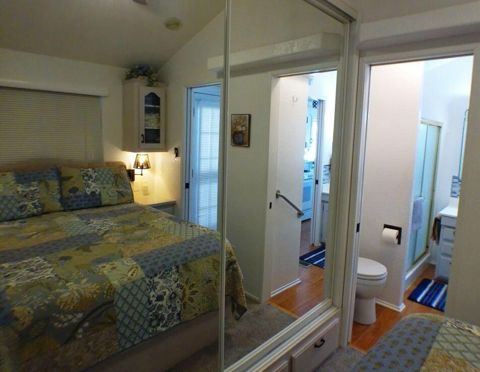 84136 Ave 44, Unit 628 Indio, CA 92203 - Photo 32 of 34 a bedroom with a bed and a couch