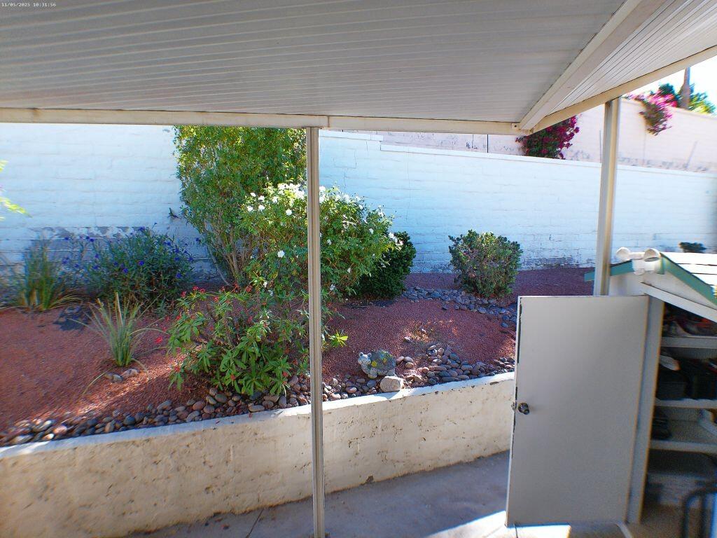 84136 Ave 44, Unit 628 Indio, CA 92203 - Photo 10 of 34 a front view of a house with a yard and potted plants
