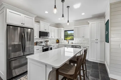 a kitchen with a sink and cabinets