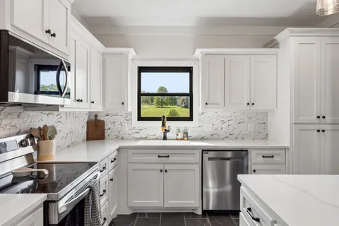 a view of a kitchen area with furniture and window
