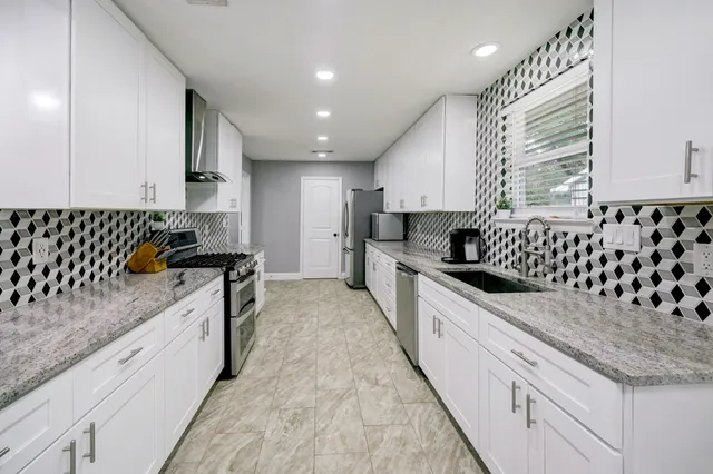 a large kitchen with cabinets