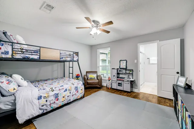 a bedroom with a bed and furniture