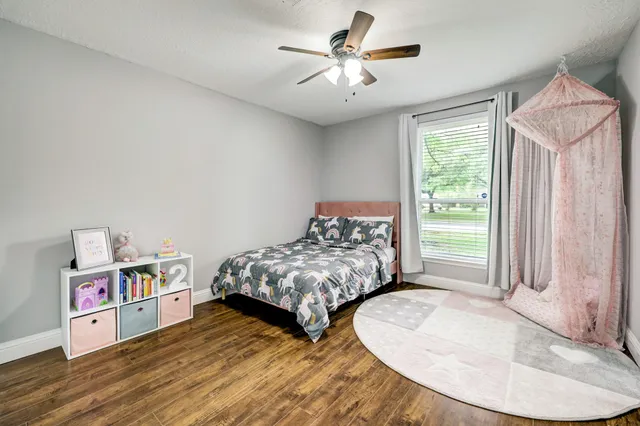 a bedroom with furniture and a chandelier