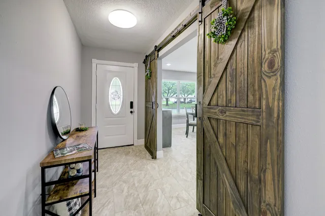 workspace with wooden floor mirror and windows