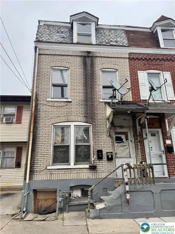 a front view of a building with glass windows