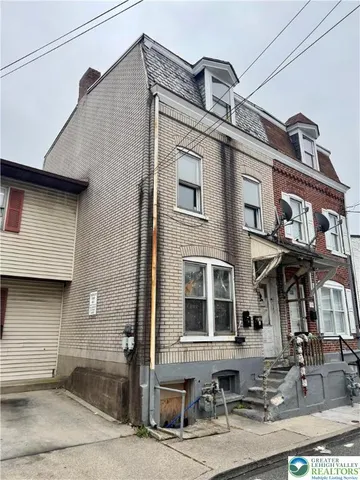 a front view of a building with windows