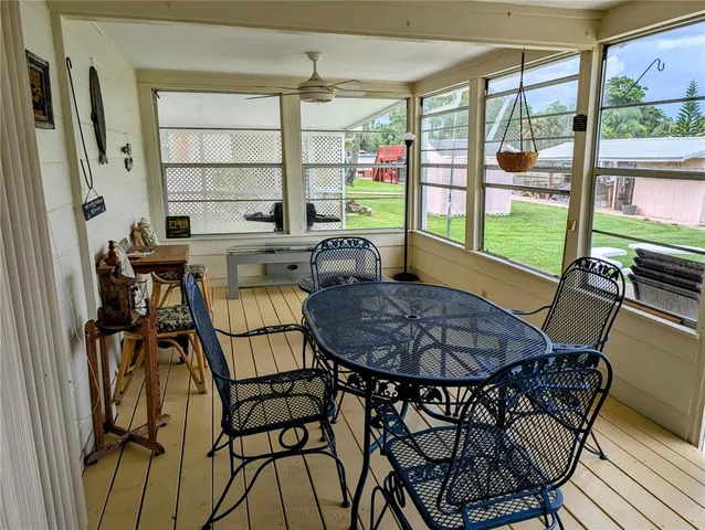 a outdoor dining space with furniture and outdoor view