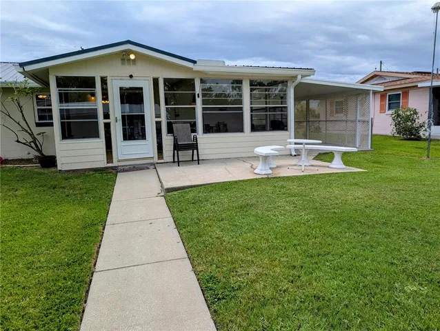a front view of a house with a yard and porch