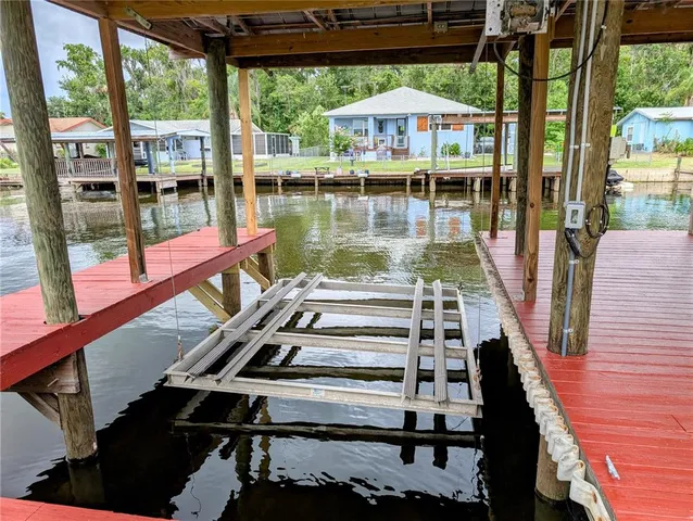 a view of a balcony with two chairs and a table