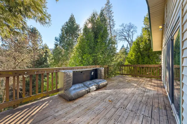 a balcony with wooden floor and wooden floor