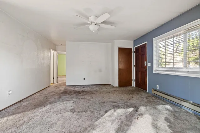 a view of an empty room with a window