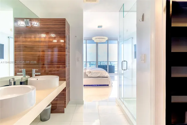 a en suite bathroom with a tub shower and sink