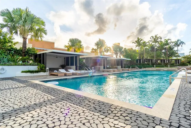a view of a swimming pool with a patio