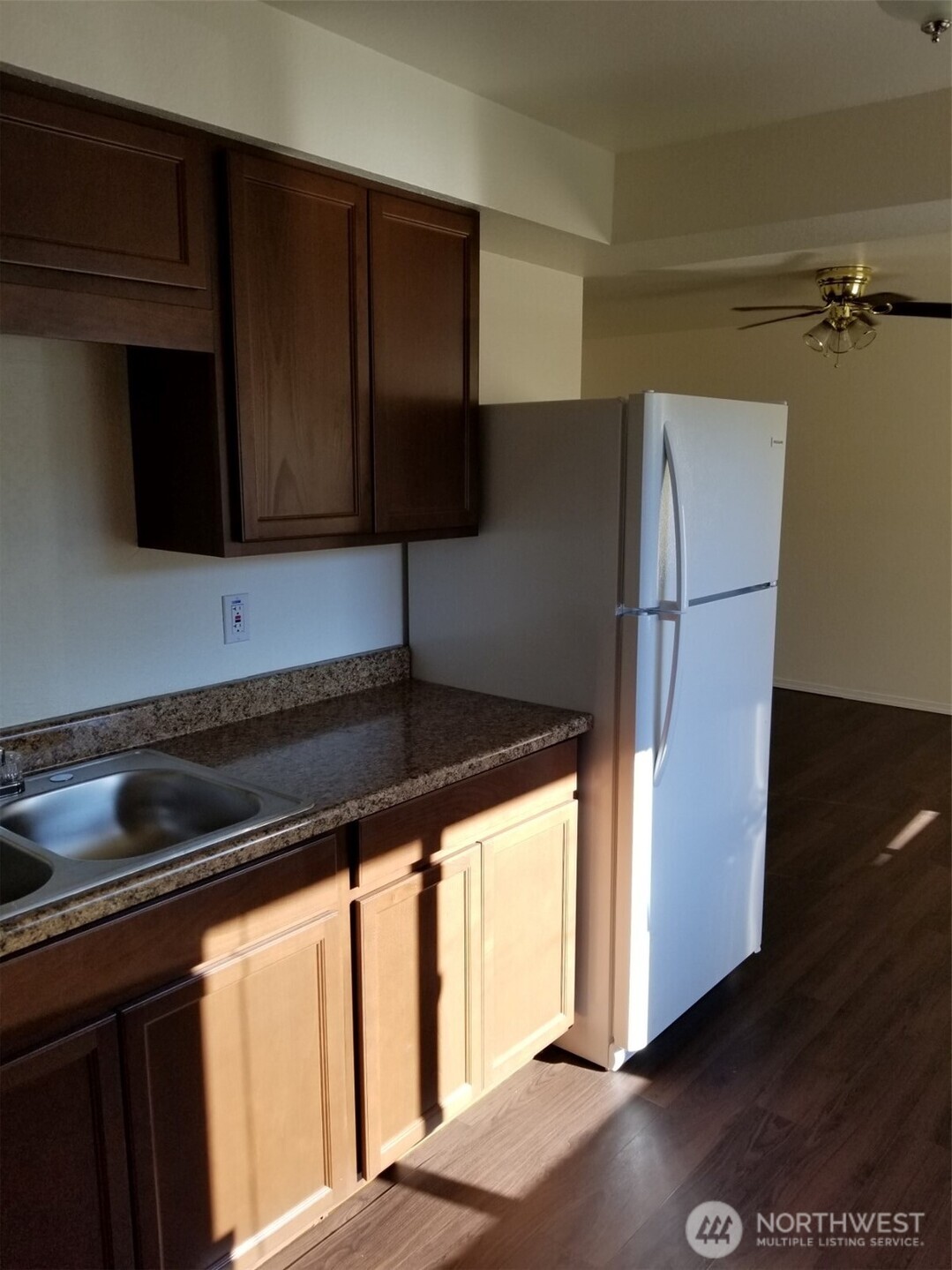 218 3rd Avenue Southwest Pacific, WA 98047 - Photo 13 of 16 a kitchen with a refrigerator and a stove top oven